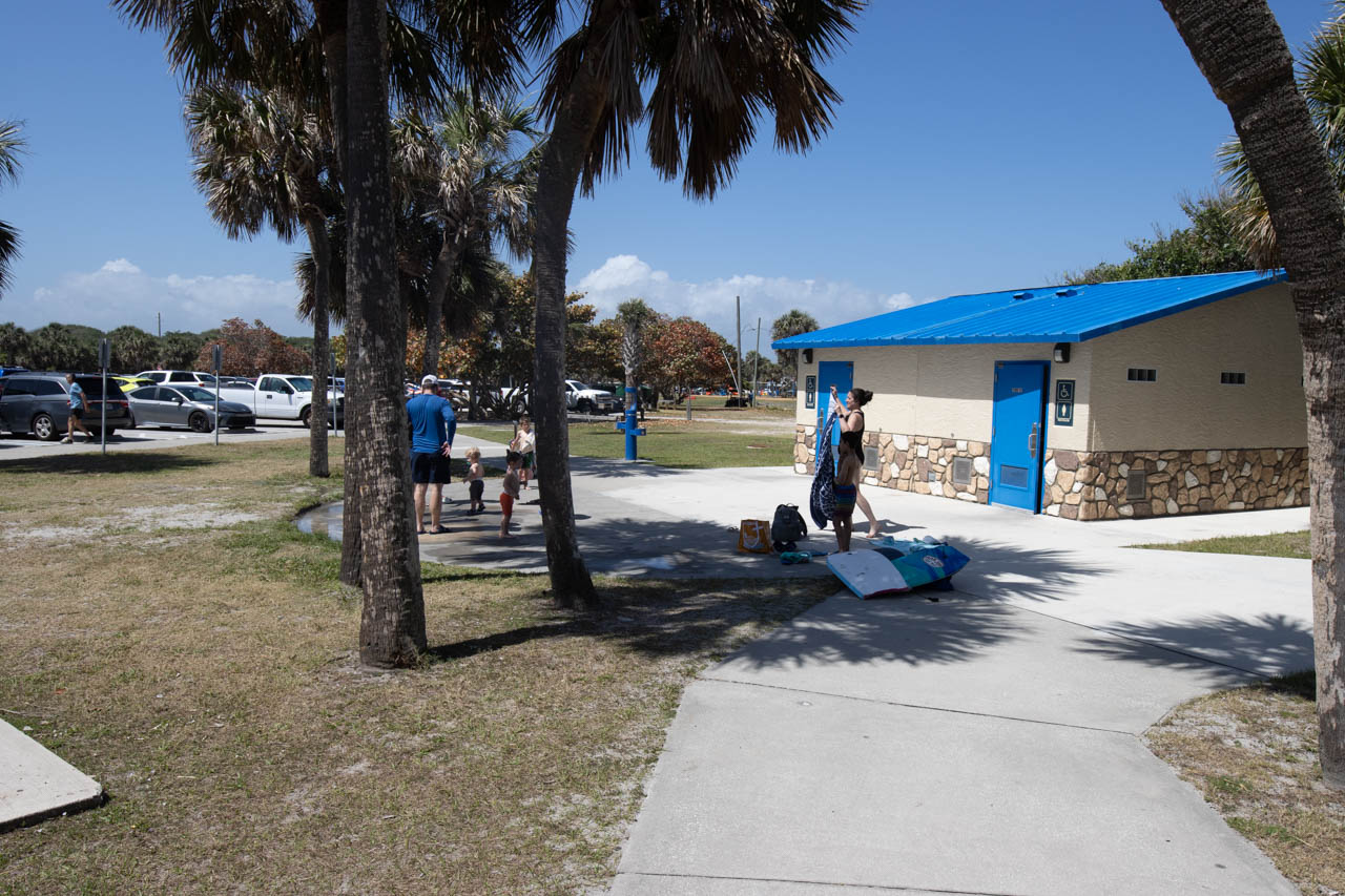 View from the north beach entrance back at the showers, bathrooms, parking in the background